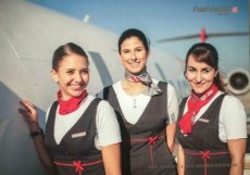 Airline issue postcard - Helvetic Airways - Stewardess Crew